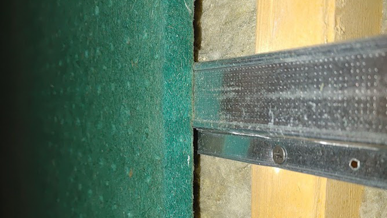 The metal channel limits vibration through the walls.